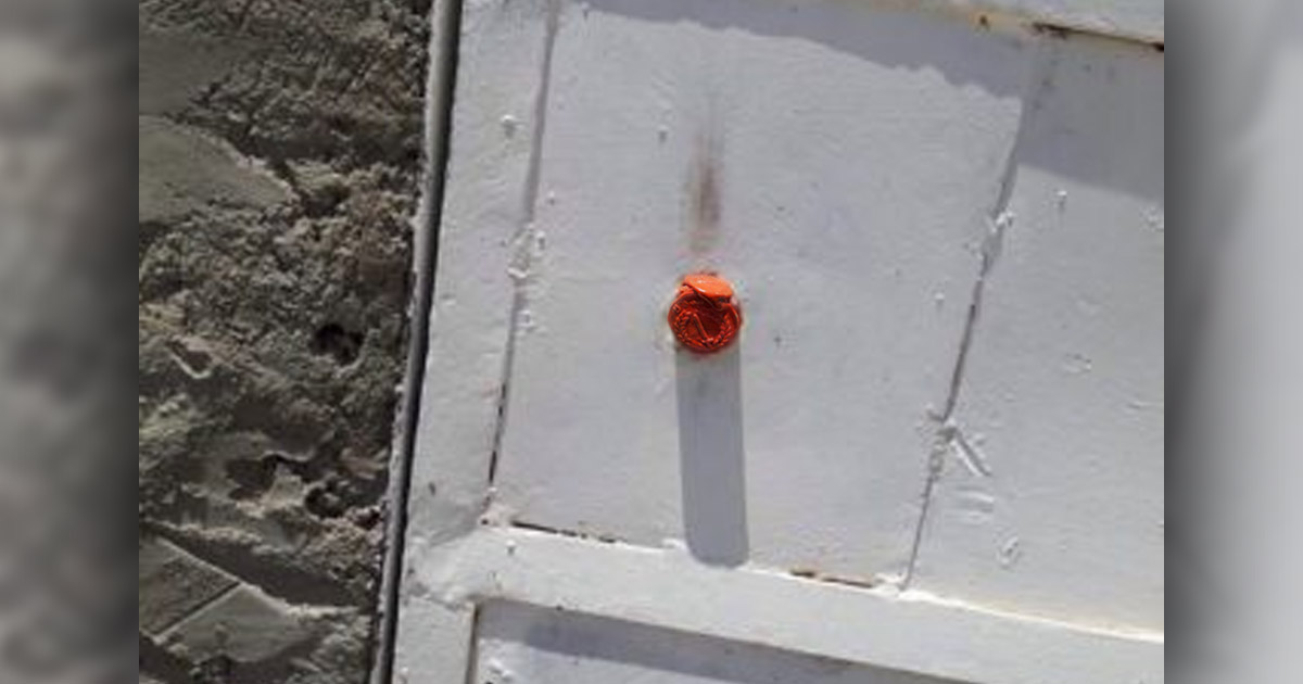 A seal on a church door.