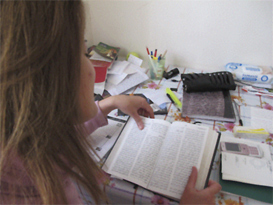 An Algerian woman reads the New Testament.