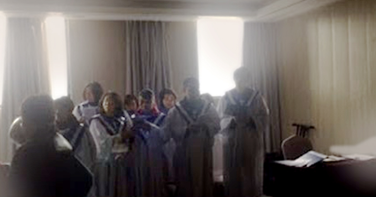 Screenshot of a choir singing