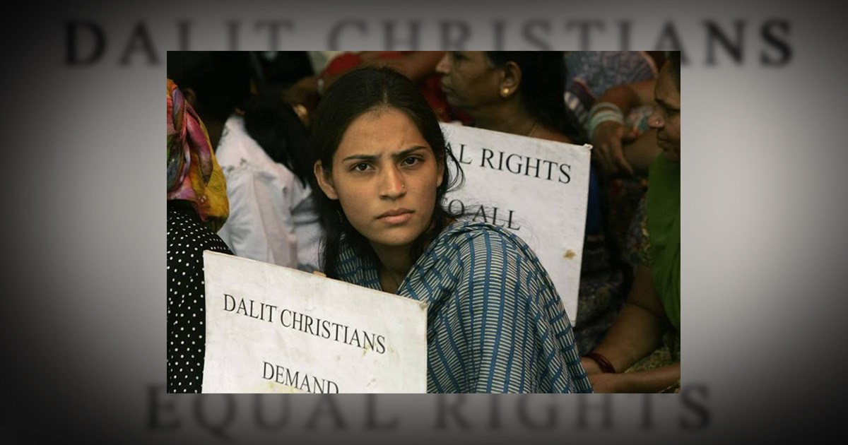 Women holding signs demanding freedom for Christian Dalits