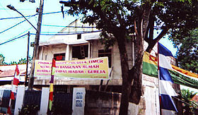 Banners calling for a ban on churches and religious services