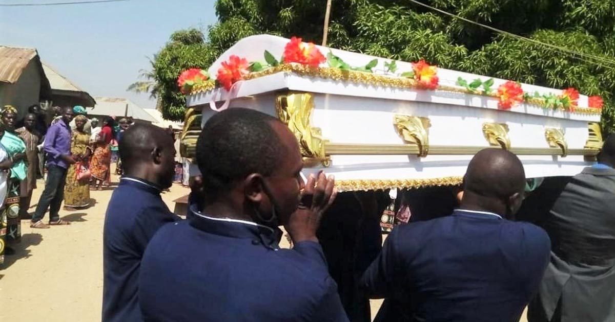 Men carrying the casket of a slain believer.