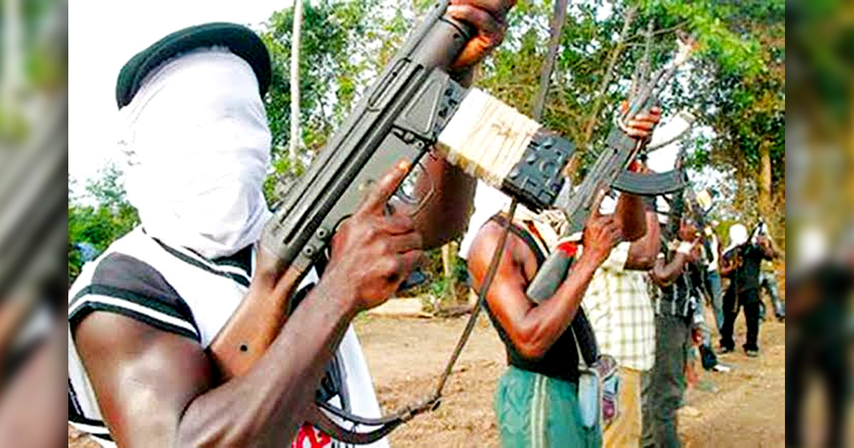 Men with their faces covered, holding weapons