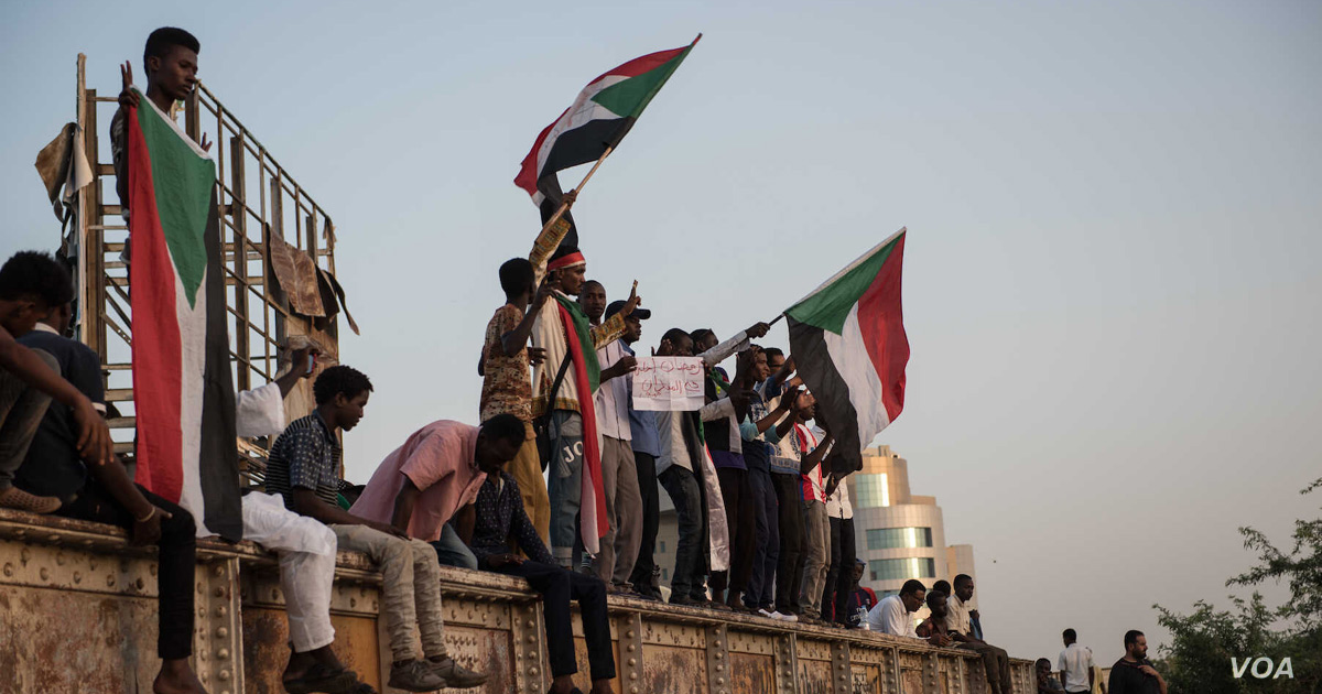 Sudanese people and flags