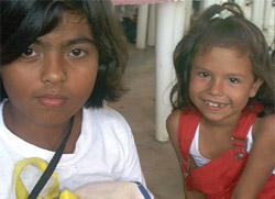 Two girls are looking at the camera.